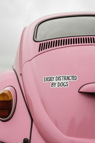 "EASILY DISTRACTED BY DOGS" STICKER